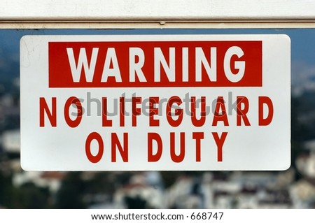 No lifeguard on duty sign on a plexiglass wall