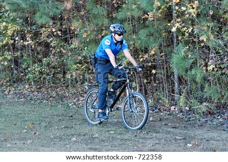 Police officer rides a bicycle