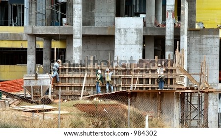 Construction workers building a form for concrete