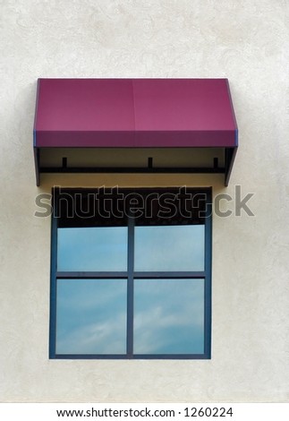 Single four paned window with a maroon awning