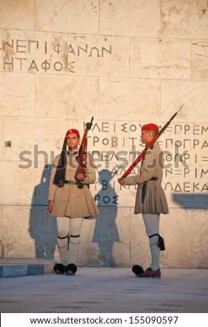ATHENS-AUGUST 4: Evzones guard the Tomb of the Unknown Soldier on August 4, 2013 in Athens, Greece. The Evzones is the name of  elite light infantry and mountain units of the Greek Army.