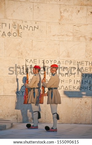 ATHENS-AUGUST 4: Evzones guard the Tomb of the Unknown Soldier on August 4, 2013 in Athens, Greece. The Evzones is the name of  elite light infantry and mountain units of the Greek Army.