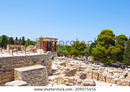 CRETE,GREECE-JULY 21: Tourists at the Knossos palace on July 21,2014 on the Crete island in Greece. Knossos is the largest Bronze Age archaeological site on the island of Crete, Creece.