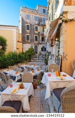 CORFU-AUGUST 27: Cosy outside restaurant waits for its guests to have a meal on August 27,2014 on the island of Corfu, Greece.