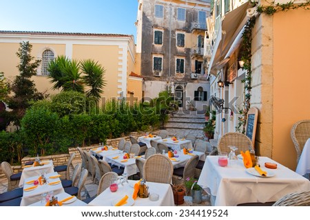 CORFU-AUGUST 27: The outside restaurant invites its guests to have a meal with warm atmosphere on August 27,2014 on the island of Corfu, Greece.