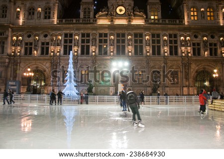 PARIS-JANUARY 9: New Year\'s ice skating and illuminated the Hotel de ville at night on January 9,2012 in Paris. Hotel de ville is the building housing the City of Paris\'s administration.
