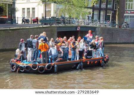 AMSTERDAM-APRIL 27:  King\'s Day boating on April 27, 2015 in Amsterdam, the Netherlands. King\'s Day (Koningsdag) is held on 27 April (the king\'s birthday) every year.