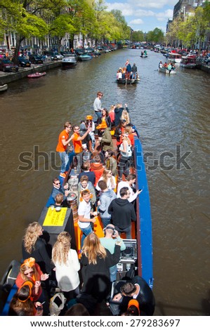 AMSTERDAM-APRIL 27: Local people on Party Boat with unlimited beer celebrate King\'s Day on April 27,2015. King\'s Day is the largest open-air festivity in Amsterdam.