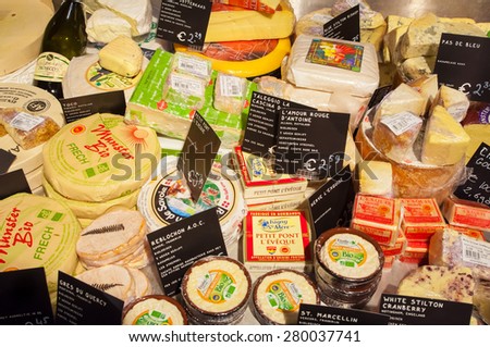 AMSRETDAM-APRIL 28: Traditional brands of Dutch cheese displayed for sale in a local shop on April 28,2015.The Netherlands produces a variety of the hard or semi-hard tempting cheeses.