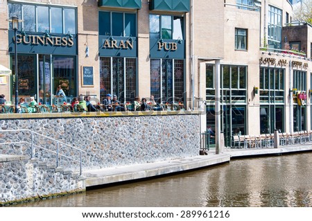 AMSTERDAM-APRIL 30: Undefined tourists have breakfast in Aran Irish Pub on April 30,2015, the Netherlands.  Aran Irish Pub is a very relaxing and enjoyable place.