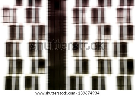 The abstract photograph of a facade with symmetrically arranged windows / Window facade