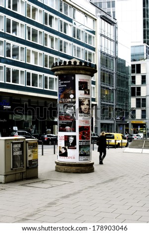 FRANKFURT, GERMANY - FEBRUARY 19: An advertising column with posters and billboards in the city center of Frankfurt on February 19, 2014 in Frankfurt / Advertising pillar