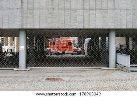FRANKFURT, GERMANY - FEBRUARY 19: An ambulance of the Samaritan organization behind the bars of a fire department entrance on February 19, 2014 in Frankfurt / Emergency access road
