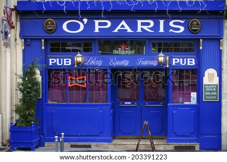 PARIS, FRANCE - DECEMBER 30: The colorful and illuminated entrance of the beer bar O \'Paris on December 30, 2013 in Paris / Beer pub O \'Paris