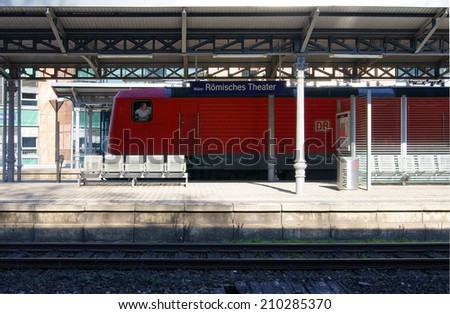 MAINZ, GERMANY - MARCH 2: A train driver looks backwards out his train window at the station Mainz Roman Theater on March 02, 2011 in Mainz / Station Mainz