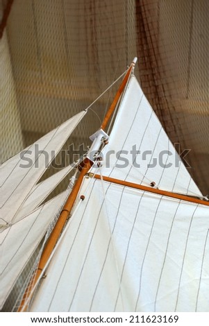 The closeup of a sail from a ship model / Ship canvas and fishing net
