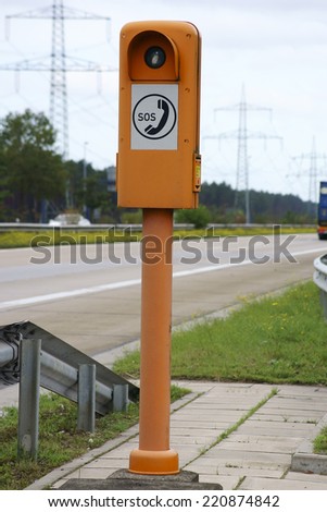The photograph of a emergency telephone at the roadside of a highway / Emergency telephone