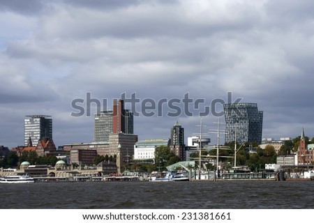 HAMBURG, GERMANY - SEPTEMBER 22: Modern Architecture and the harbor promenade of the Harbor City on September 22, 2014 in Hamburg. / Modern architecture in Hamburg