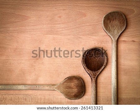 abstract kitchen background Three old wooden spoon