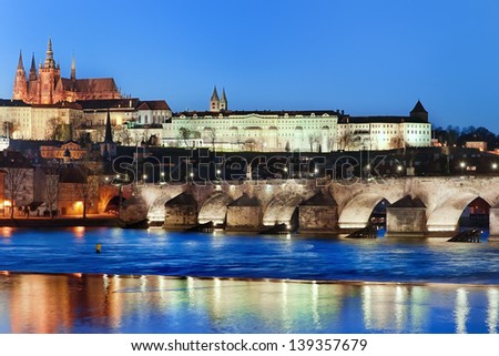 Charles Bridge and Vltava river by night, in the background the castle, Prague