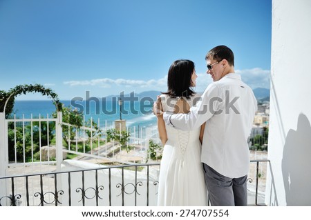 happy couple looking at each other in wedding day in Italy