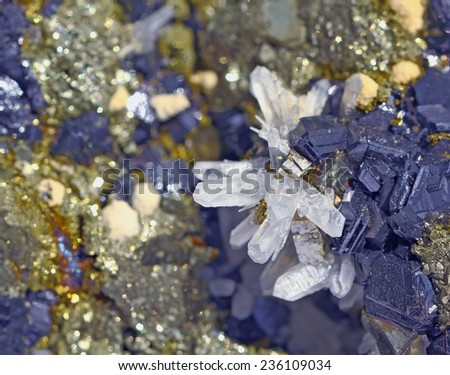 On wards blue galena and  limpid white quartz in the background shimmer of the same