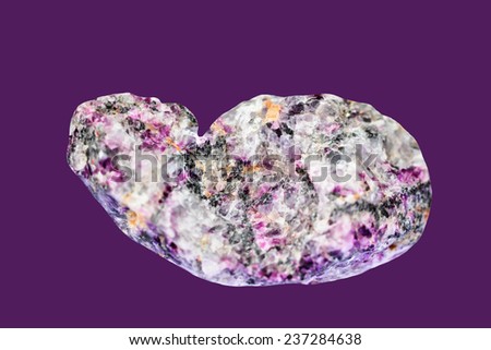 Pigmentary pink tourmalines ( rubellite) with quartz, isolated on  dark purple  background