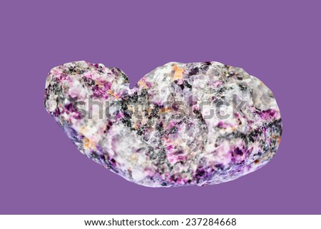 Pigmentary pink tourmalines ( rubellite) with quartz , isolated on matte purple background