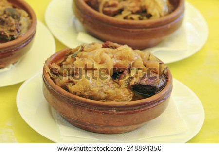 Cooked cabbage with meat in clay pot