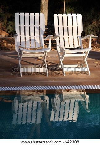 Outdoor chairs near swimming pool