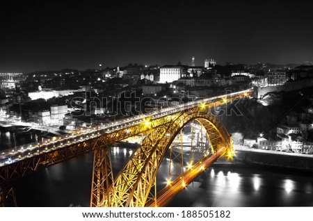 Golden Bridge on a monochromatic background, night view of the  Dom Luiz bridge captured on a slow shutter, Porto , Portugal