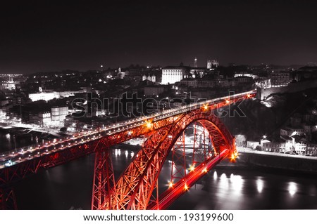 Red Bridge on a monochromatic background, night view of the Dom Luiz bridge captured on a slow shutter, Porto , Portugal