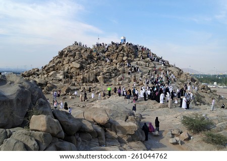MECCA, SAUDI ARABIA - FEB 3: Muslims at Mount Arafat (or Jabal Rahmah) February 3, 2015 in Arafat, Saudi Arabia. This is the place where Adam and Eve met after being overthrown from heaven.