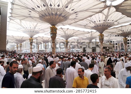 MEDINA, SAUDI ARABIA - JAN 30: After Friday prayers, Muslims gathered in front of the mosque of the prophet on January 30, 2015 in Medina, KSA. Nabawi Mosque is the second holiest mosque in Islam