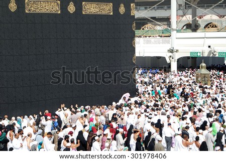 MECCA, SAUDI ARABIA - FEBRUARY 4: Muslim pilgrims, from all around the World, revolving around the Kaaba on February 4, 2015 in Mecca, Saudi Arabia. Muslim people praying together at holy place.