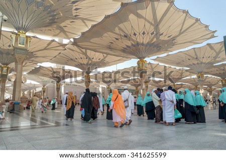 MEDINA, SAUDI ARABIA-JAN 30: Muslims from different countries in the courtyard of the mosque of the Prophet on January 30, 2015 in Medina, KSA. The Nabawi mosque is the second holiest mosque in Islam.