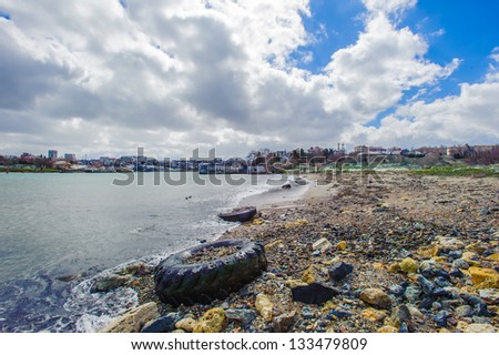 Trash on the shore of the sea like wheel