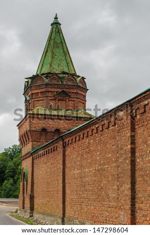 Red wall surrounding the Orthodox monastery in Old Ladoga town, Russia