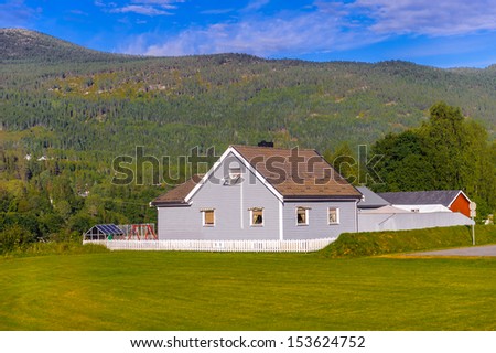 Small building on the green nature of a Summer Norway