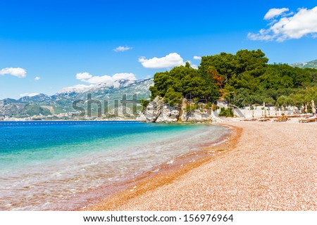 Beautiful landscape of the rock and the transparent water of the sea and the yellow clean sand