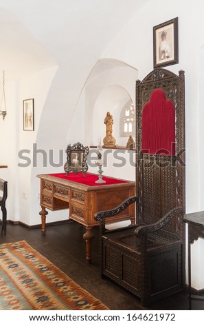 BRAN, ROMANIA - OCTOBER 27, 2013:  Interior of a room in the Dracula Castle in Bran, Romania, on October 27, 2013. It is marketed as the home of the Vampire Dracula, the Bram Stoker\'s novel character.