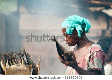 Ghana - March 2, 2012: Unidentified Ghanaian Woman Works On A Fish Market In Ghana, On March 2nd, 2012. People In Ghana Suffer From Poverty Due To The Slow Development Of The Country