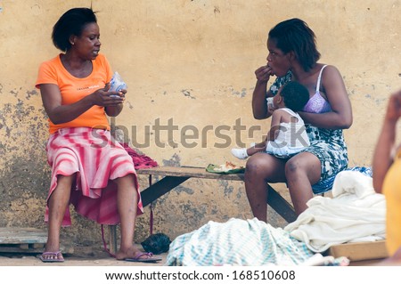 GHANA - MARCH 2, 2012: Two unidentified Ghanaian women discuss something in Ghana, on March 2nd, 2012. People in Ghana suffer from poverty due to the slow development of the country
