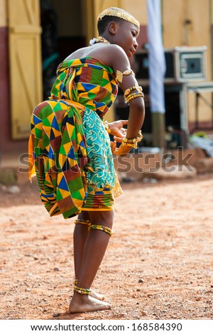 GHANA - MARCH 3, 2012: Unidentified Ghanaian woman dances traditional African dance in Ghana, on March 3rd, 2012. Music is the main kind of entertainment in Africa