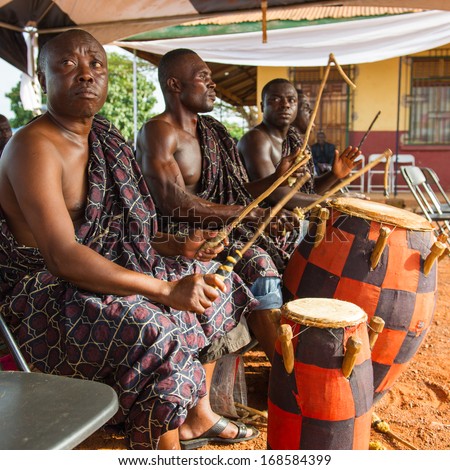 GHANA - MARCH 3, 2012: Unidentified Ghanaian local musicians play the traditional African music with the drums in Ghana, on March 3rd, 2012. Music is the main kind of entertainment in Africa