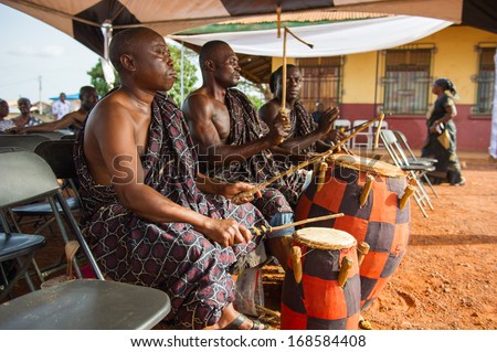 GHANA - MARCH 3, 2012: Unidentified Ghanaian local musicians play the traditional African music with the drums in Ghana, on March 3rd, 2012. Music is the main kind of entertainment in Africa
