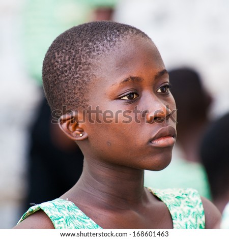 GHANA, ACCRA - MARCH 2, 2012: Portrait of a student from the Saint Leo School who came to see the Elmina Castle in Accra, Ghana, on Mar.2, 2012. Children from all faiths may study in the St Leo School
