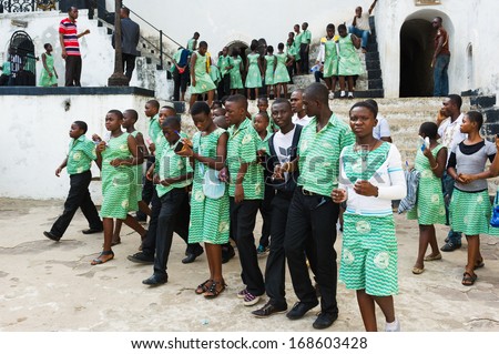 GHANA, ACCRA - MARCH 2, 2012: Student in green uniform from the Saint Leo School who came to Elmina Castle in Accra, Ghana, on March 2nd, 2012. Children from all faiths may study in the St Leo School.
