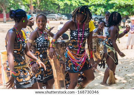 ANGOLA, LUANDA - MARCH 4, 2013: Group of the Angolan women improvise a street concert in Angola, Mar 4, 2013. Music is one of the main African entertainments.