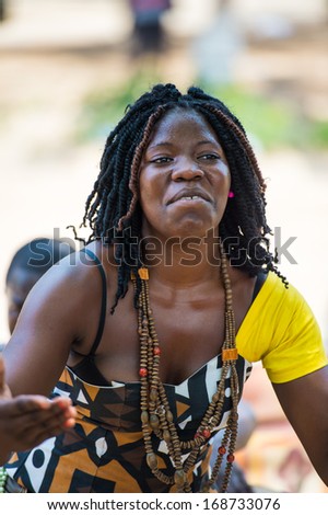 ANGOLA, LUANDA - MARCH 4, 2013:  Angolan beautiful woman dances the national folk dance in Angola, Mar 4, 2013. Music is one of the main African entertainments.